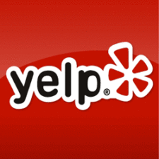 Yelp logo on a red background, featuring the word "yelp" in bold white and black letters and a stylized red and white burst shape to the right of the text.